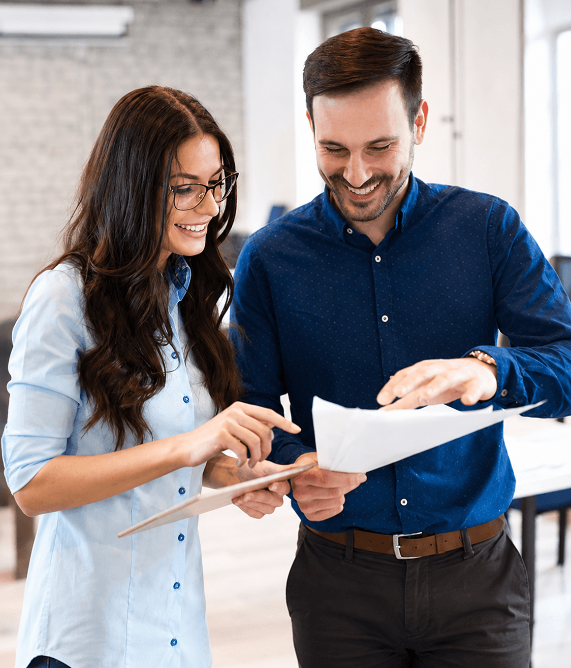 Two colleagues reviewing a document
